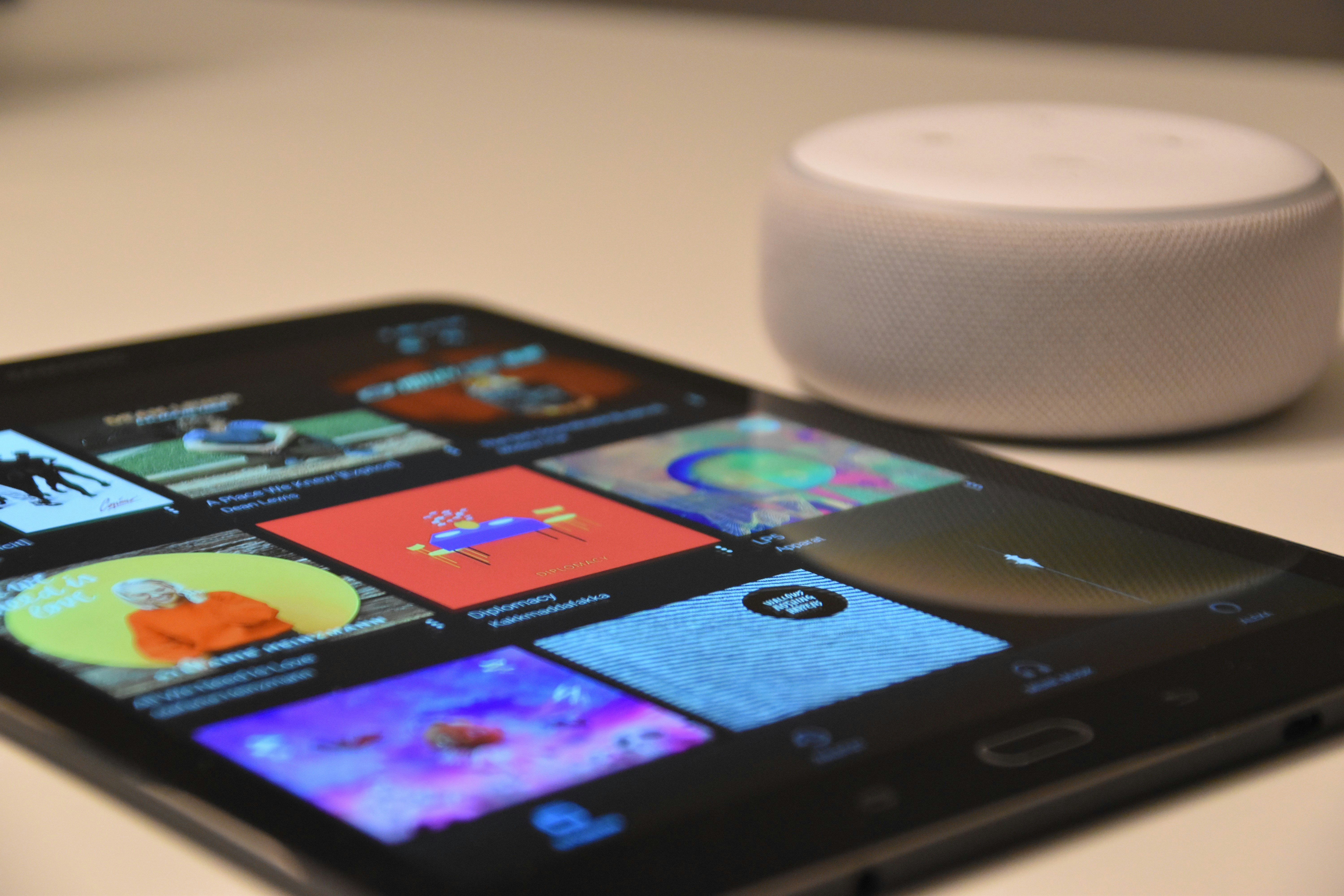 A cell phone open to a smart home app lying on a table